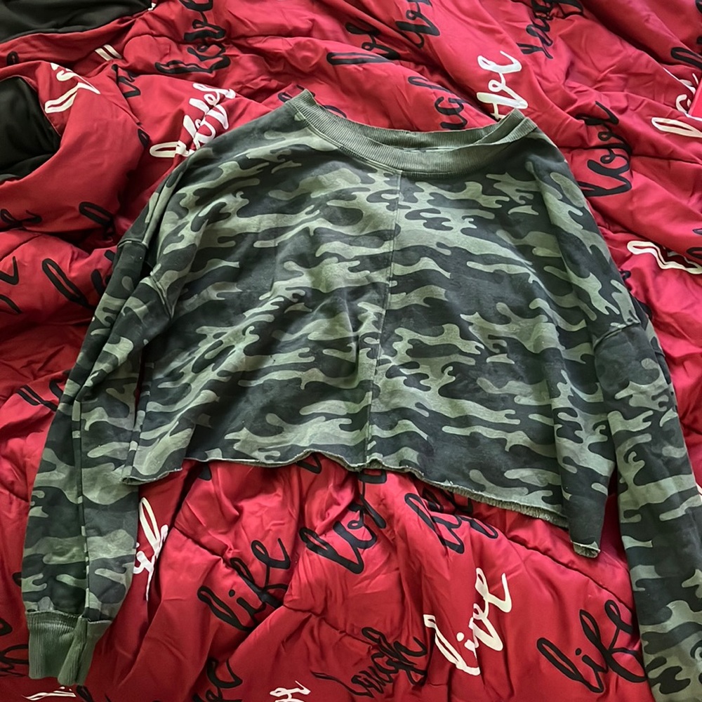 A cropped Camo long sleeve top